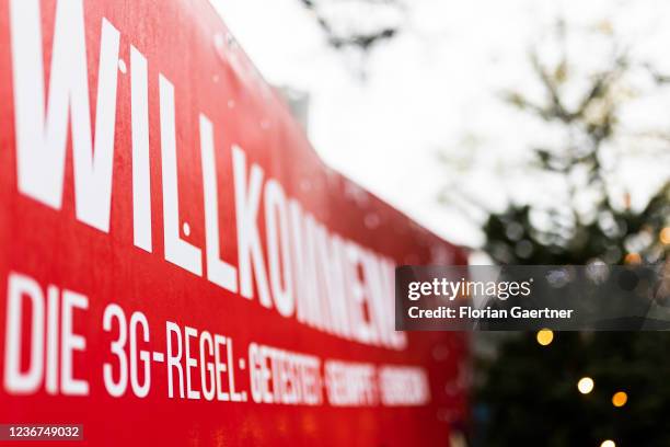 Sign to point out the access with 3G is pictured in front of the christmas market at the Breitscheidplatz on November 23, 2021 in Berlin, Germany.