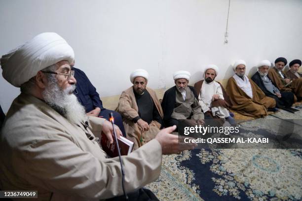 Shiite cleric Nuri al-Saedi addresses his students during a lesson in Iraq's central holy shrine city of Najaf as religious schools reopen after more...