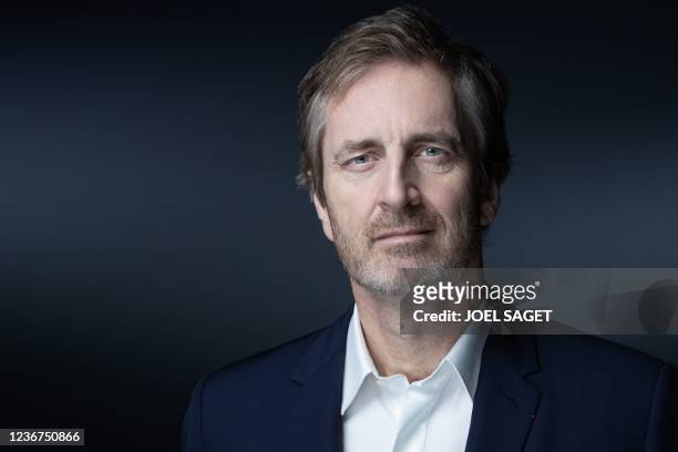 French Musee du Louvre's bord of directors' member and co-founder of the Webhelp Group Frederic Jousset poses during a photo session in Paris on...