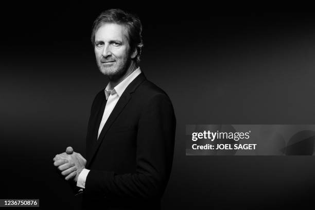 French Musee du Louvre's bord of directors' member and co-founder of the Webhelp Group Frederic Jousset poses during a photo session in Paris on...