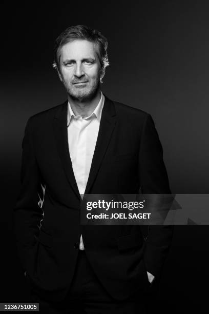 French Musee du Louvre's bord of directors' member and co-founder of the Webhelp Group Frederic Jousset poses during a photo session in Paris on...