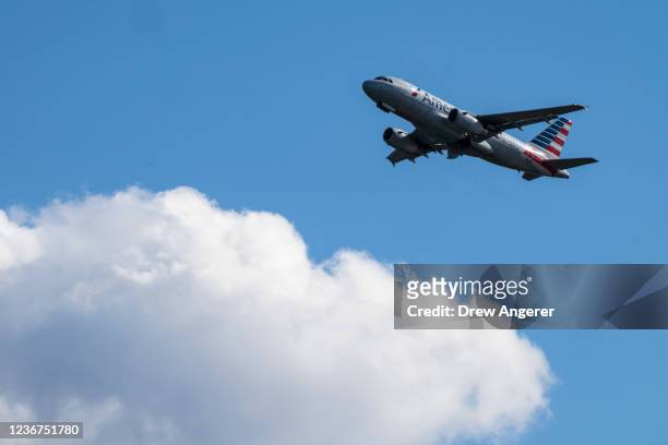 An American Airlines plane takes off from Ronald Reagan Washington National Airport November 23, 2021 in Arlington, Virginia. With Covid-19...