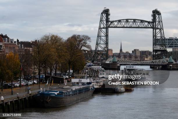 Picture shows barges docked on the Koningshaven waterway as they Koningshavenbrug "De Hef" lift bridge and the Koninginnebrug drawbridge are seen in...