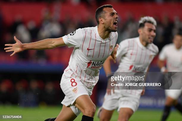 Sevilla's Spanish midfielder Joan Jordan celebrates after scoring his team's first goal during the UEFA Champions League Group G football match...
