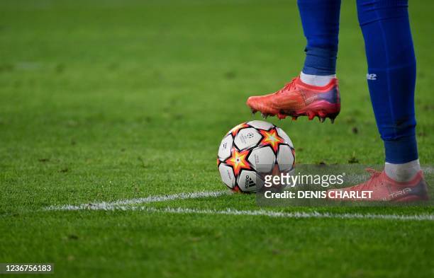 This photograph shows a player waiting with his cleat on the ball during the UEFA Champions League first round group G football match between Lille...