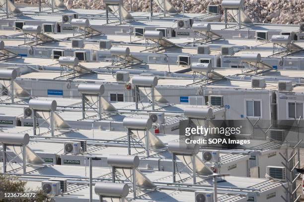 View of the prefabricated containers with solar panels and water boilers on top, of the new housing facility for asylum seekers mostly from the...
