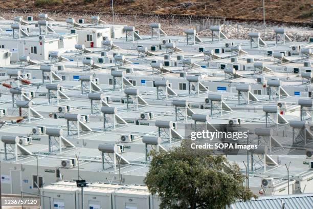 View of the prefabricated containers with solar panels and water boilers on top, of the new housing facility for asylum seekers mostly from the...