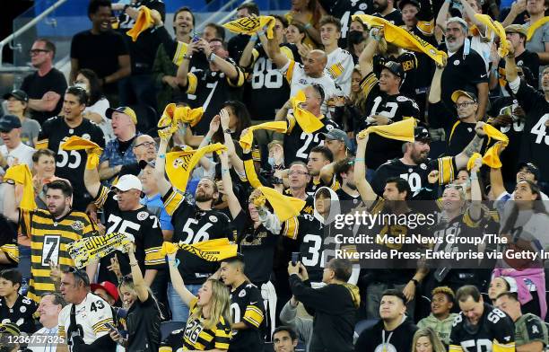 Inglewood, CA Pittsburgh Steelers fans wave their terrible towels after a Steelers touchdown against the Los Angeles Chargers in the first half of...