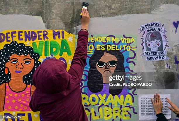 Women activists take part in a protest in support of Roxana Ruiz Santiago accused of murder after she killed a man when defending herself from a...