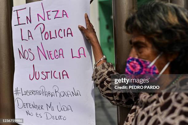 An activist takes part in a protest in support of Roxana Ruiz Santiago accused of murder after she killed a man when defending herself from a rape,...