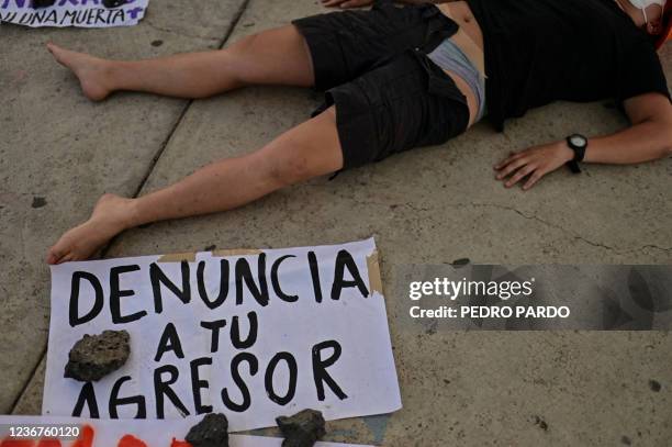 Woman activist takes part in a protest in support of Roxana Ruiz Santiago accused of murder after she killed a man when defending herself from a...