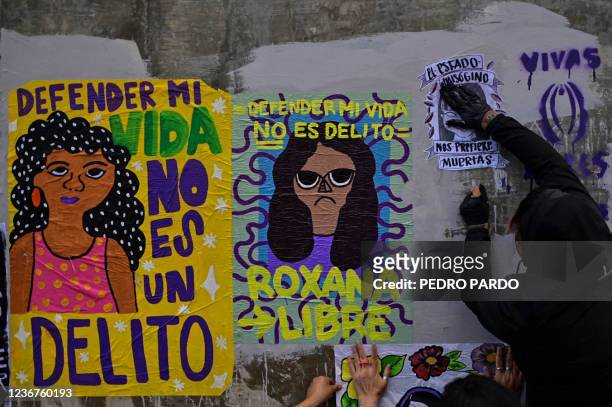 An activist takes part in a protest in support of Roxana Ruiz Santiago accused of murder after she killed a man when defending herself from a rape,...