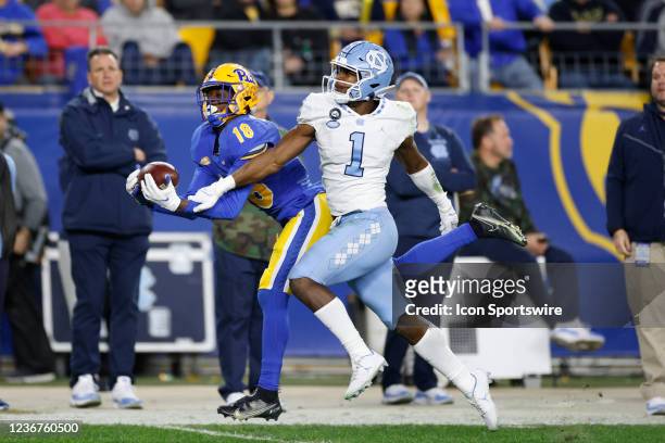 Pittsburgh Panthers wide receiver Shocky Jacques-Louis catches a pass along the sideline while defended by North Carolina Tar Heels defensive back...