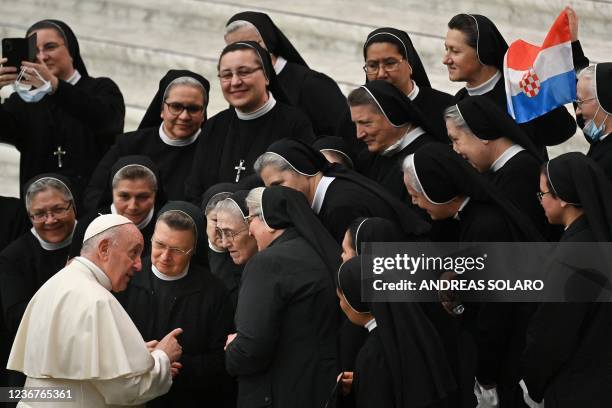 Pope Francis meets with a group of nuns at the end of the weekly general audience on November 24, 2021 at Paul-VI hall in The Vatican.