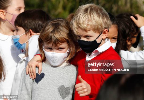 Monaco's Prince Jacques and his sister Princess Gabriella pose as they plant a South African tree on the terraces of the Casino to celebrate the...