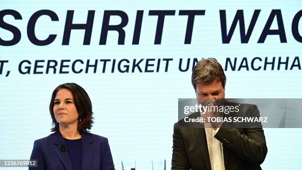 The co-leaders of Germany's Greens party Annalena Baerbock and Robert Habeck address a statement along with the leaders of the SPD and the FDP...