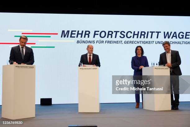 Olaf Christian Lindner, leader of the German Free Democrats , Olaf Scholz, SPD member and likely next German chancellor, Annalene Baerbock and Robert...