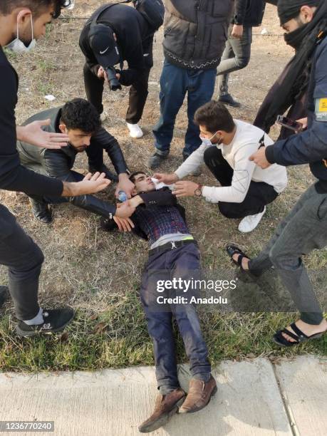 An injured demonstrator is seen after security forces' intervention as they gather to stage a protest outside University of Sulaimani in...