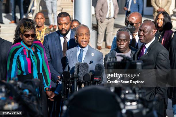 Rev. Al Sharpton, center, with Wanda Cooper-Jones, mother of Ahmaud Arbery, left, attorney Lee Merritt, second from left, attorney Ben Crump, right,...