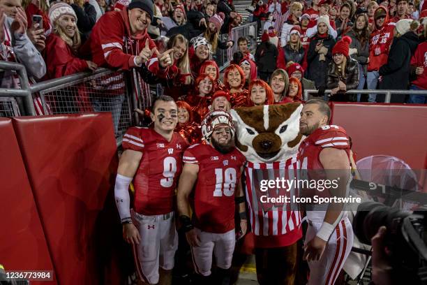 Wisconsin Badgers safety Scott Nelson , Wisconsin Badgers safety Collin Wilder , Bucky Badger, and Wisconsin Badgers tight end Jake Ferguson pose for...