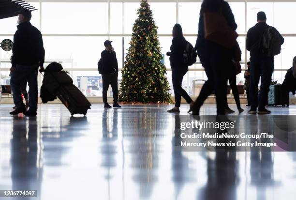 November 23: Travelers walk inside Norman Y. Mineta San Jose International Airport on Tuesday, Nov. 23 in San Jose, Calif.