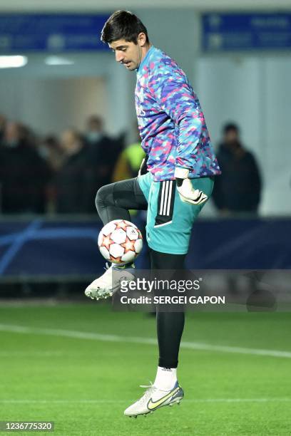 Real Madrid's Belgian goalkeeper Thibaut Courtois warms up prior to the UEFA Champions League football match between Sheriff and Real Madrid at...
