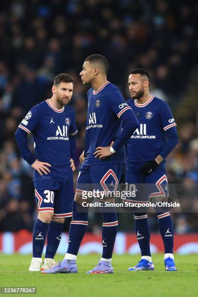 Lionel Messi, Kylian Mbappe and Neymar stand together after the equalising Man City goal during the UEFA Champions League group A match between...