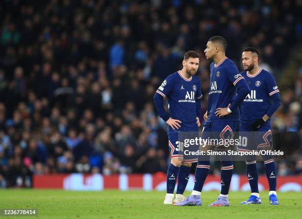 Lionel Messi, Kylian Mbappe and Neymar stand together after the equalising Man City goal during the UEFA Champions League group A match between...