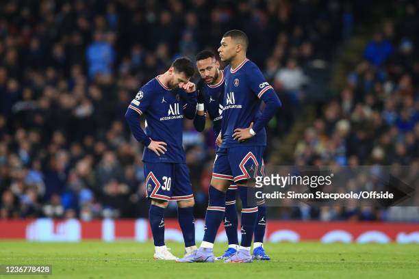 Lionel Messi, Kylian Mbappe and Neymar stand together after the equalising Man City goal during the UEFA Champions League group A match between...