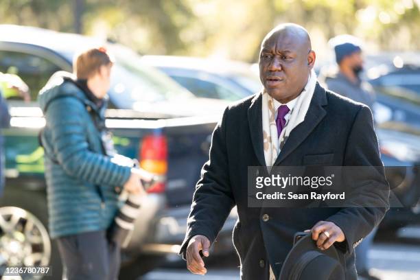 Attorney Ben Crump walks outside the Glynn County Courthouse as the jury deliberates in the trial of the killers of Ahmaud Arbery on November 24,...