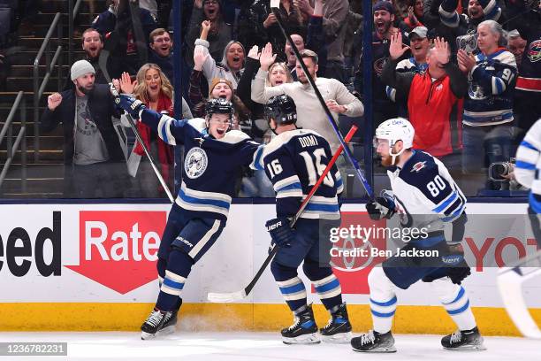 Gregory Hofmann of the Columbus Blue Jackets celebrates his first period goal with teammate Max Domi against the Winnipeg Jets at Nationwide Arena on...