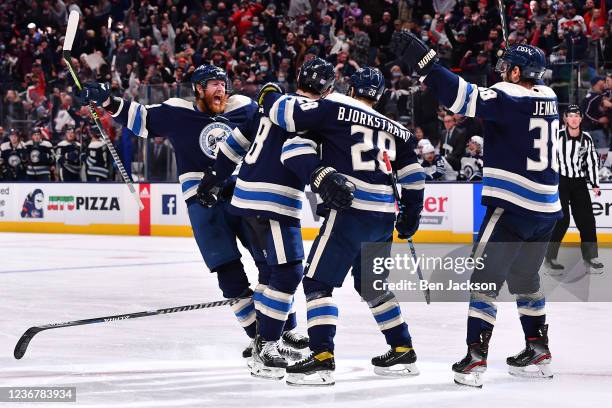 The Columbus Blue Jackets celebrate a goal by Zach Werenski during the third period against the Winnipeg Jets at Nationwide Arena on November 24,...