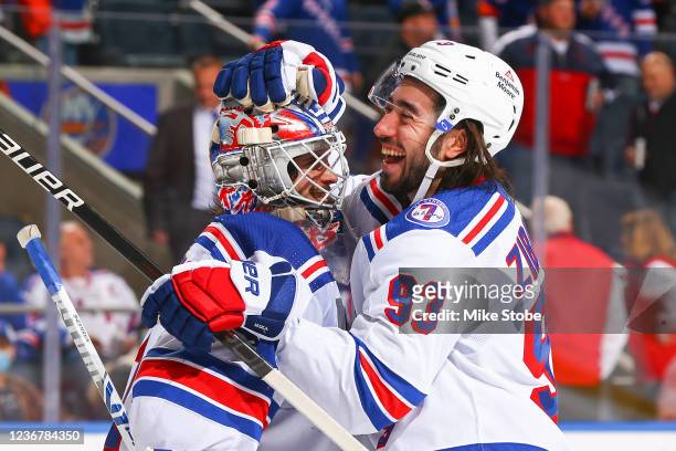 Igor Shesterkin and Mika Zibanejad of the New York Rangers celebrate their team's 4-1win against the New York Islanders at UBS Arena on November 24,...