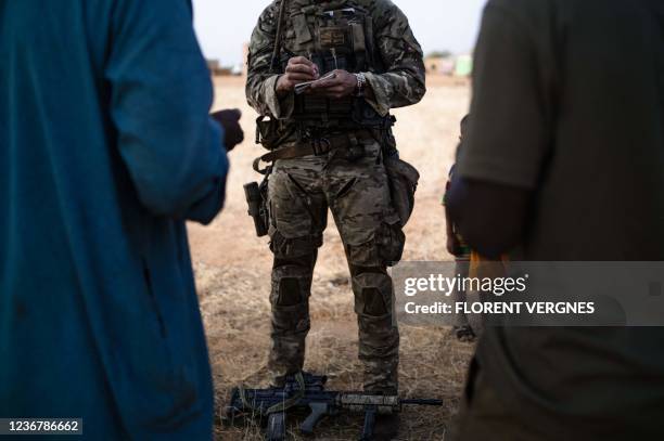 Group of villagers talk with soldiers collecting information for the United Nations Multidimensional Integrated Stabilization Mission in Mali Long...