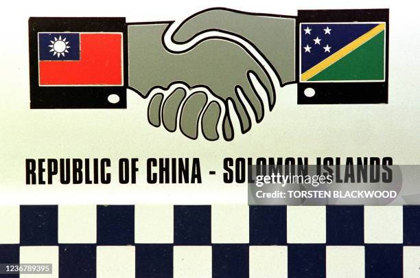 The flags of Taiwan and the Solomon Islands adorn the side of a police car in Honiara, Solomon Islands 22 June 1999 as Honiara's business community...