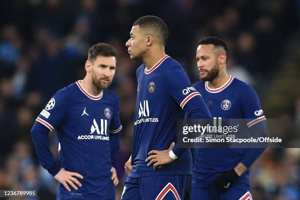 Lionel Messi of Paris Saint-Germain , Kylian Mbappe of Paris Saint-Germain and Neymar of Paris Saint-Germain look dejected during the UEFA Champions...