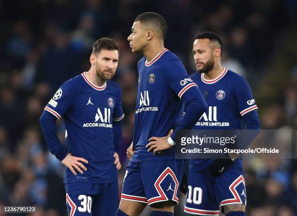 Lionel Messi of Paris Saint-Germain , Kylian Mbappe of Paris Saint-Germain and Neymar of Paris Saint-Germain look dejected during the UEFA Champions...