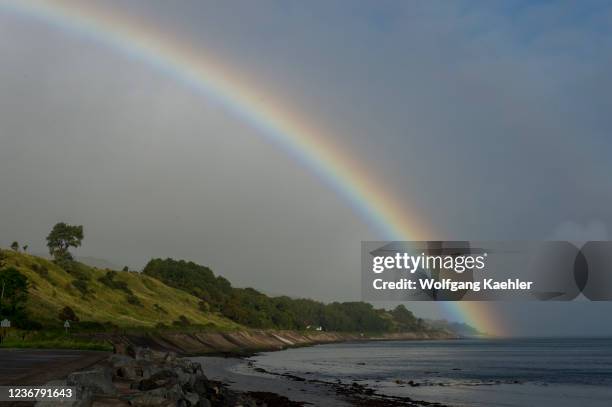 Rainbow over the coastline at Ballygally, along the Causeway Coastal Route in Northern Ireland.