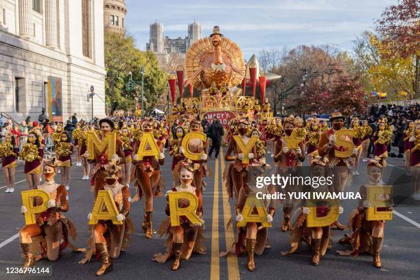 Dancers pose for a picture ahead of Macy's Thanksgiving Day Parade in New York City, New York on November 25, 2021. - This year marks the 95th annual...