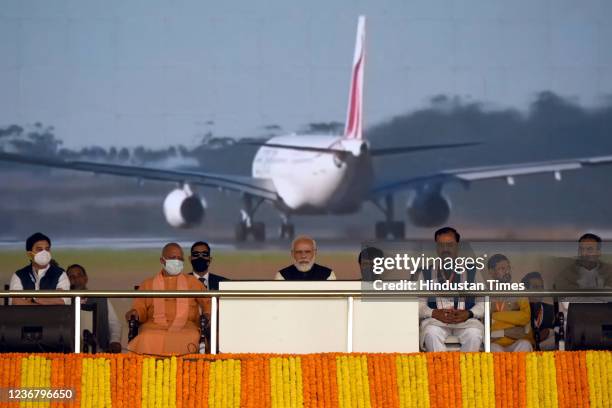 Prime Minister Narendra Modi, Uttar Pradesh Chief Minister Adityanath Yogi and other ministers on stage after the foundation stone laying ceremony of...