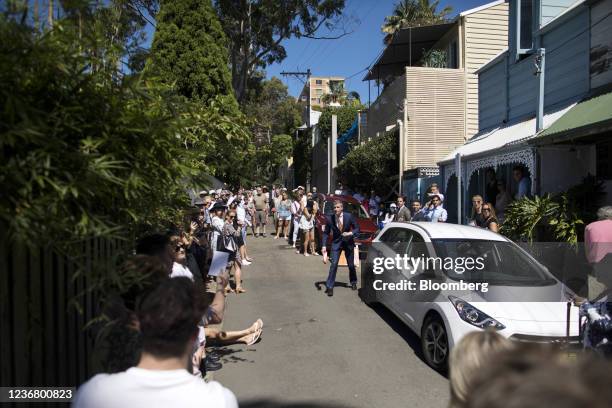 Bloomberg Best of the Year 2021: An auctioneer, center, takes a bid during an auction of a residential property in the Paddington suburb of Sydney,...