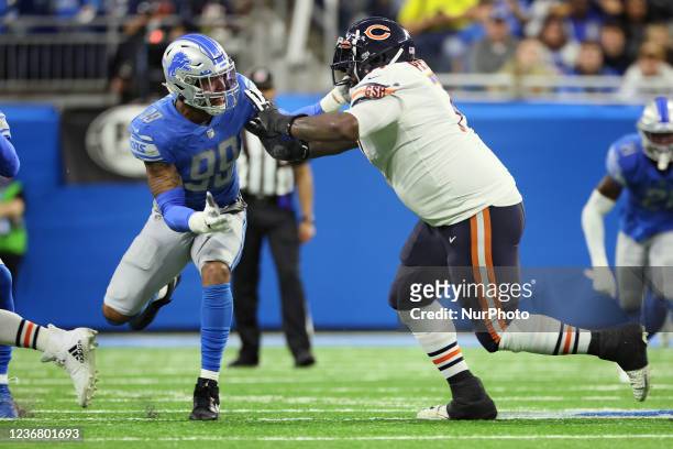 Detroit Lions linebacker Julian Okwara holds the line against Chicago Bears offensive tackle Jason Peters during an NFL football game between the...