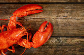 Wooden background with cooked lobster.