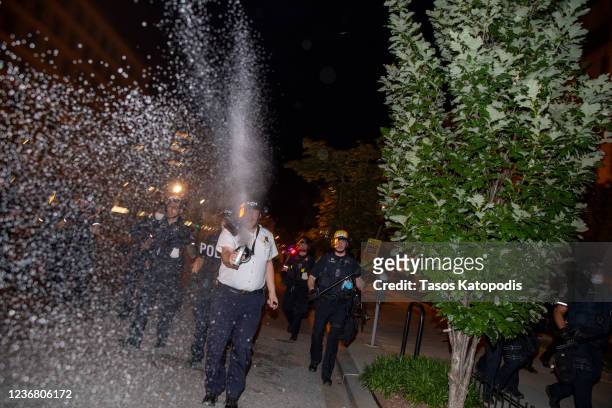 Police work to keep demonstrators back during a protest near Lafayette Square Park on May 30, 2020 in Washington, DC. Across the country, protests...