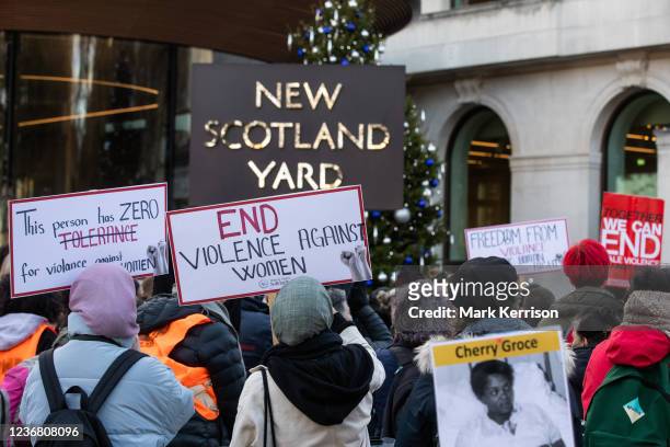 Dozens of supporters of Million Women Rise attend a vigil outside New Scotland Yard to remember the victims of male violence against women on the...