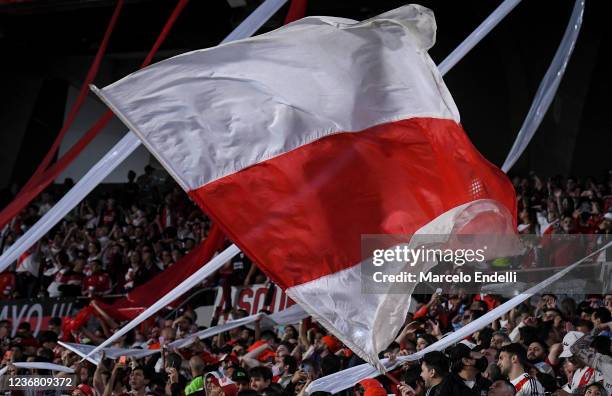 Fans of River Plate wave a flag during a match between River Plate and Racing Club as part of Torneo Liga Profesional 2021at Estadio Monumental...