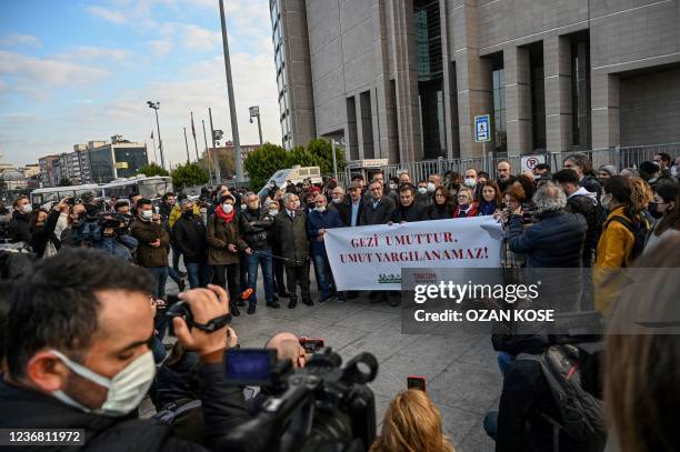 Supporters, including lawyers and opposition lawmakers, of jailed civil society leader Osman Kavala gather behind a banner reading in Turkish "Gezi...