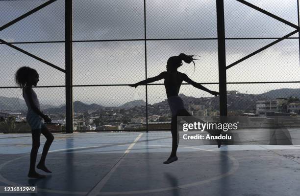 Ballet class in Morro do Adeus Favela of Rio de Janeiro in Brazil on November 24. Barefoot dancers, girls from Morro do Adeus Favela, overcome...