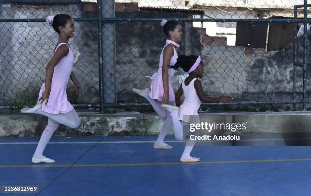Ballet class in Morro do Adeus Favela of Rio de Janeiro in Brazil on November 24. Barefoot dancers, girls from Morro do Adeus Favela, overcome...