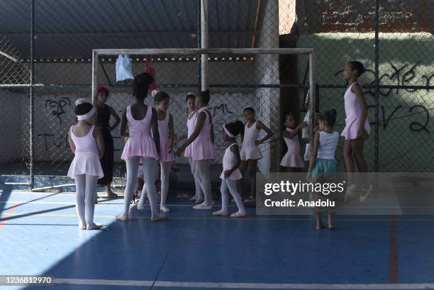 Ballet class in Morro do Adeus Favela of Rio de Janeiro in Brazil on November 24. Barefoot dancers, girls from Morro do Adeus Favela, overcome...